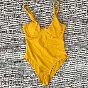 Yellow underwire bra one piece bathing suit. Never worn